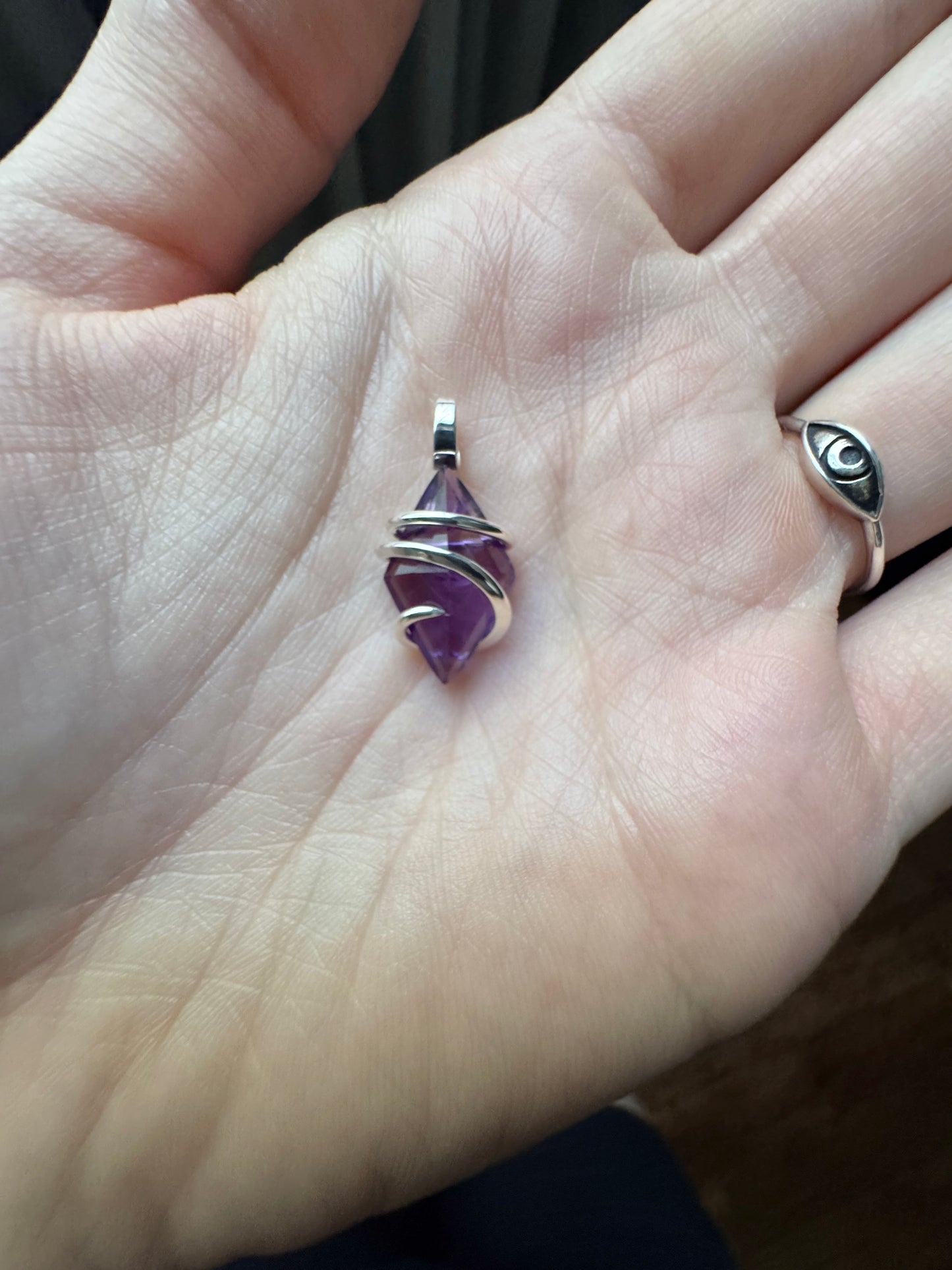 Faceted amethyst in sterling silver pendant
