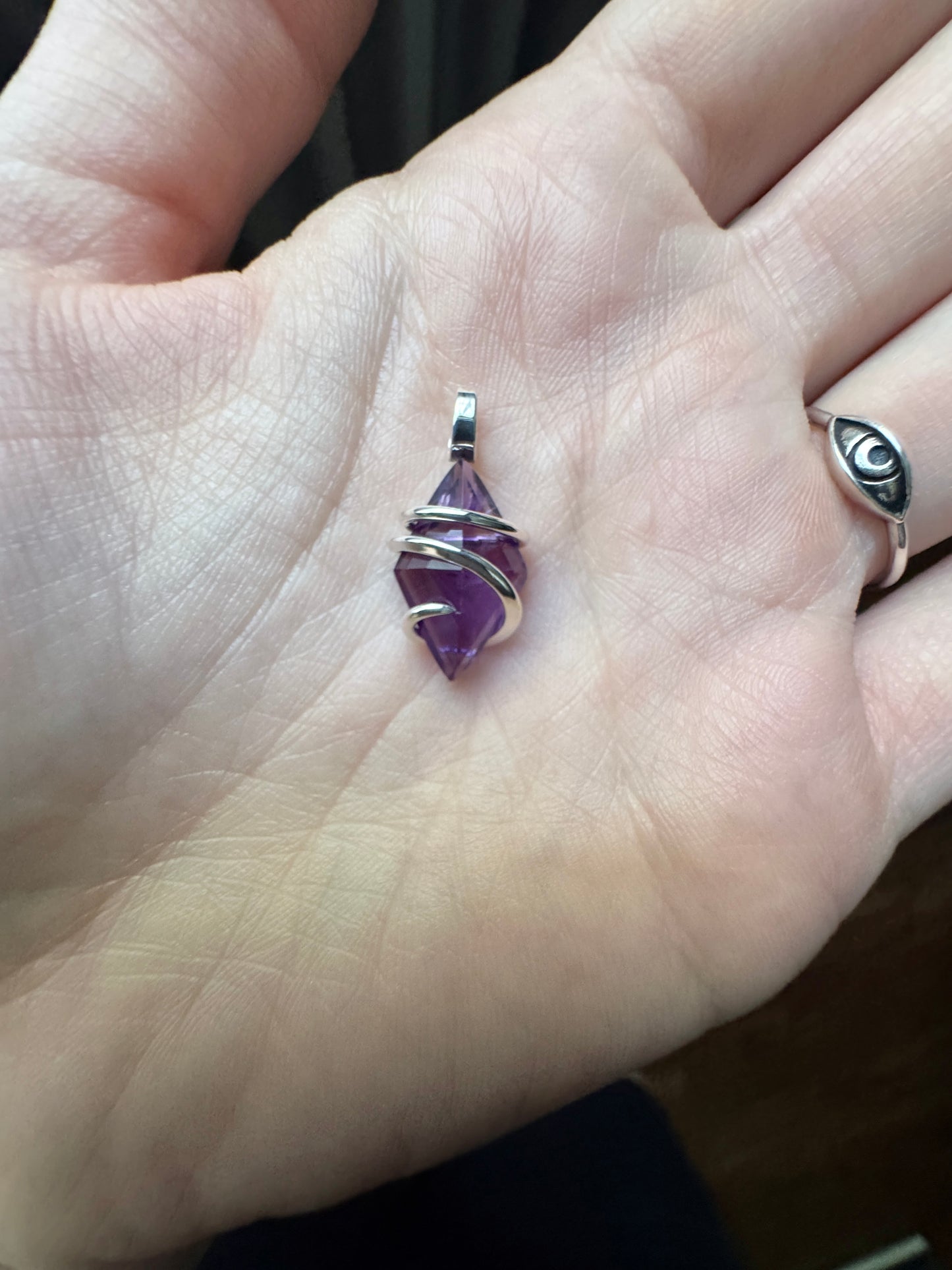 Faceted amethyst in sterling silver pendant