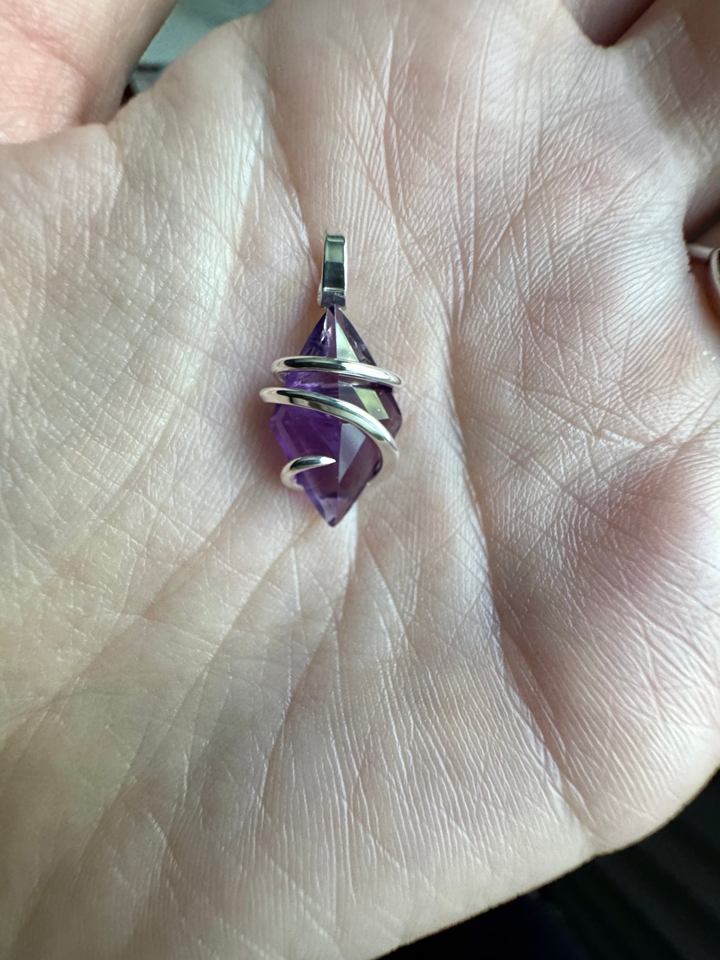 Faceted amethyst in sterling silver pendant