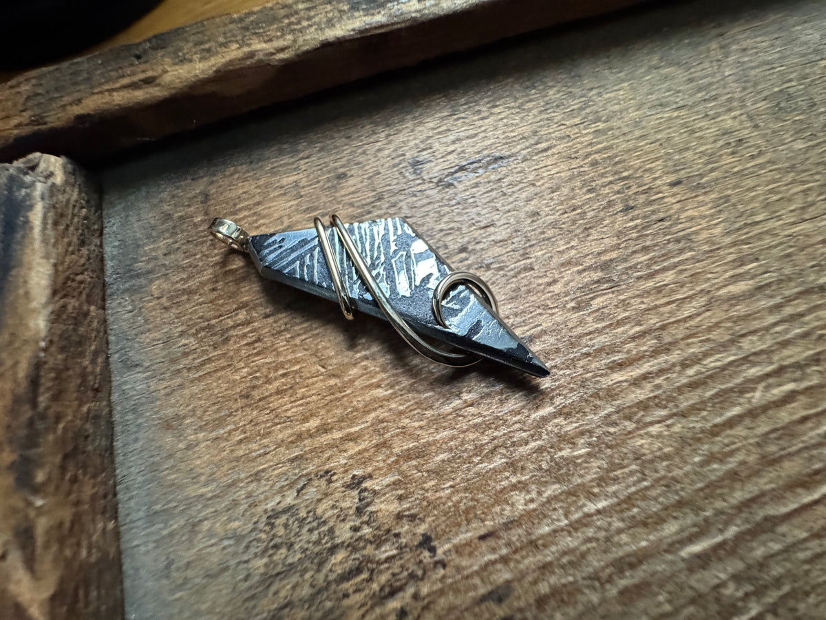 Meteorite in 14k gold pendant