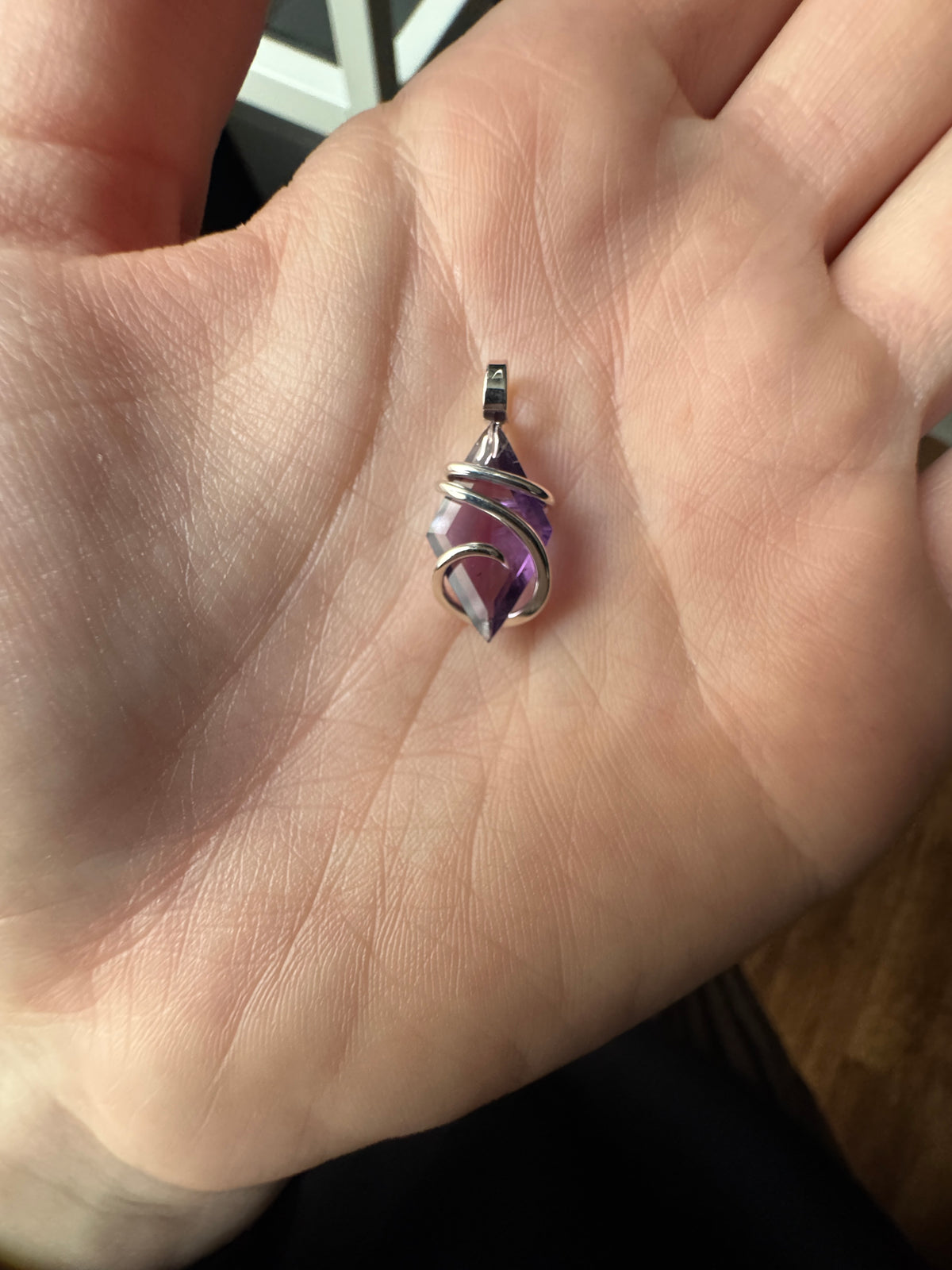 Faceted amethyst in sterling silver pendant