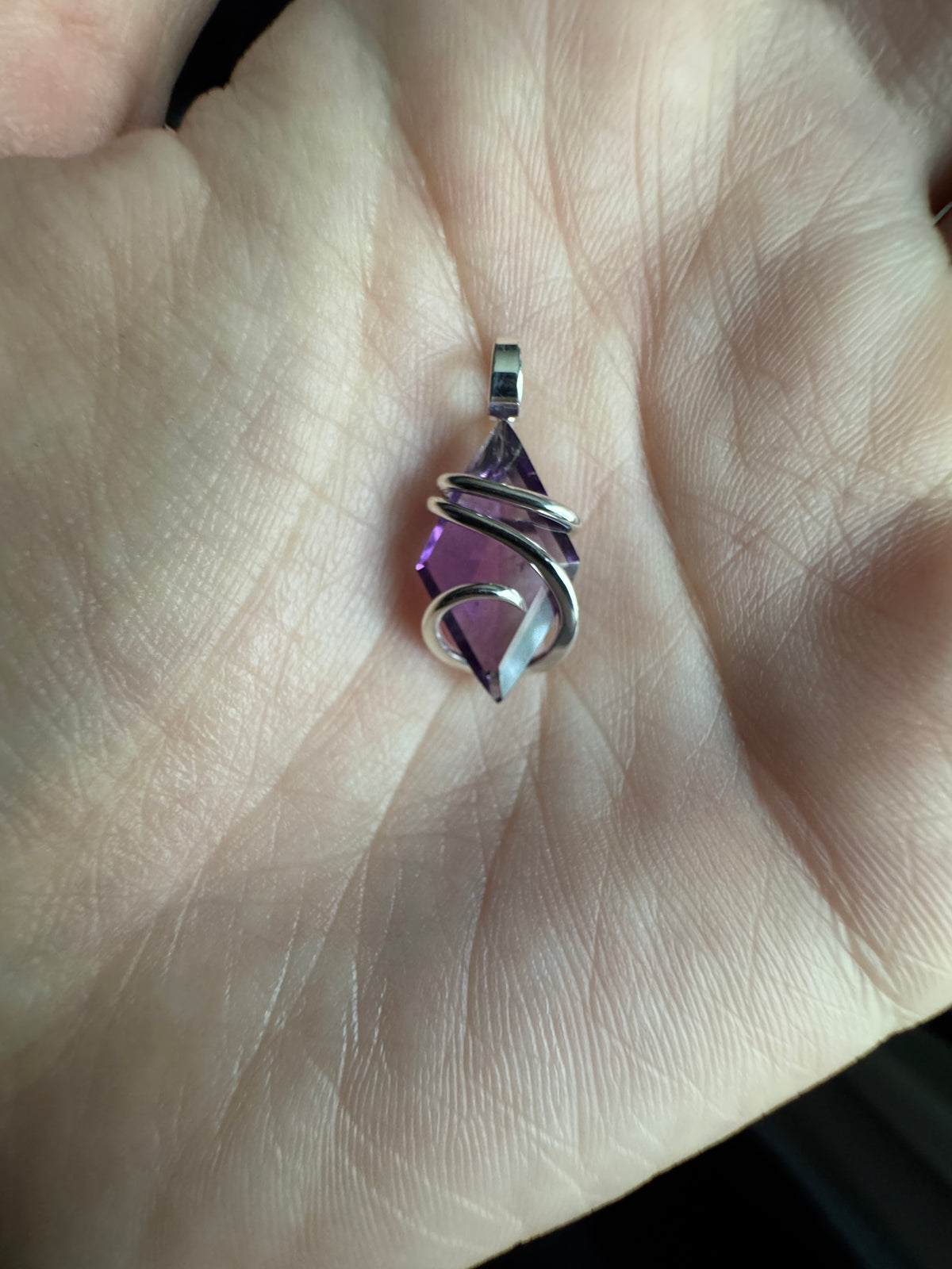 Faceted amethyst in sterling silver pendant