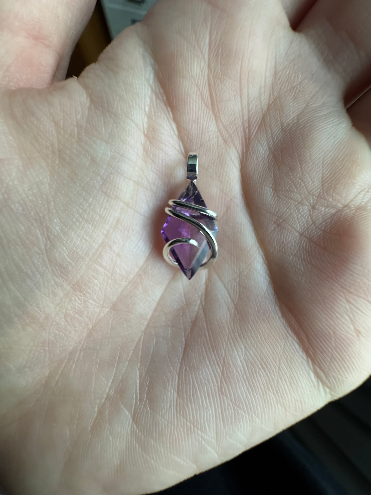 Faceted amethyst in sterling silver pendant