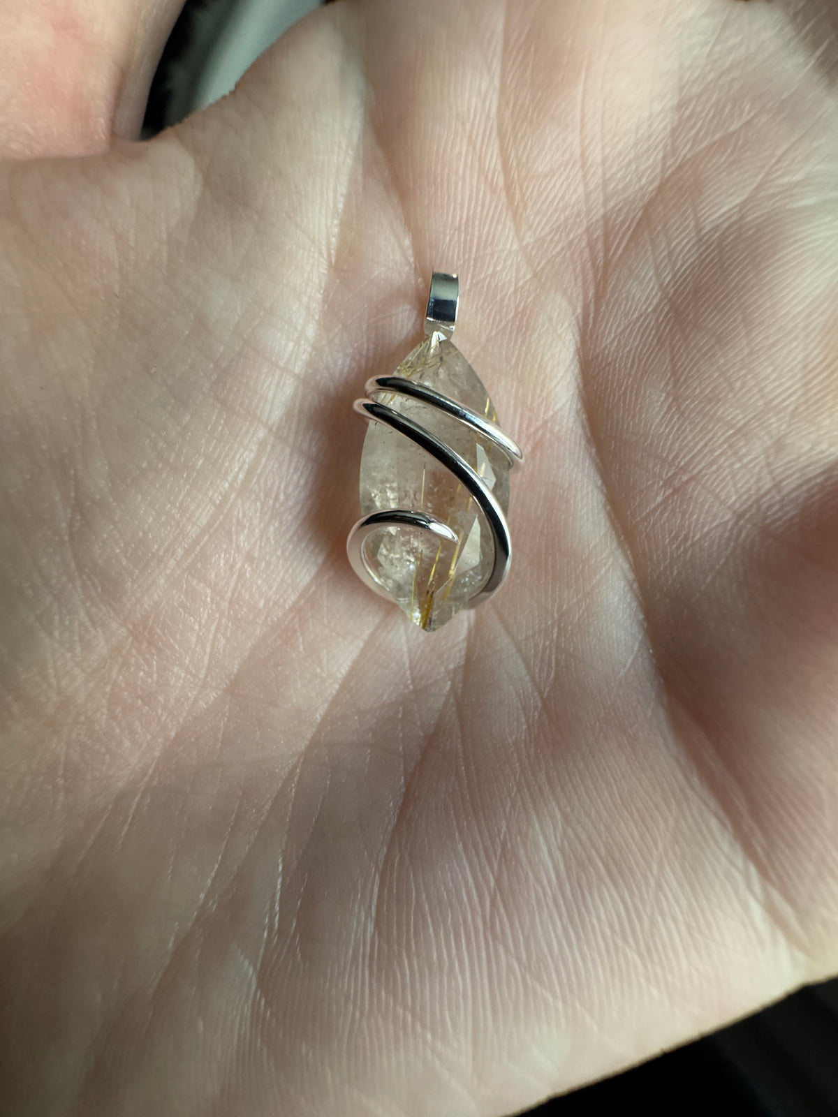 Faceted rutilated quartz in sterling silver pendant