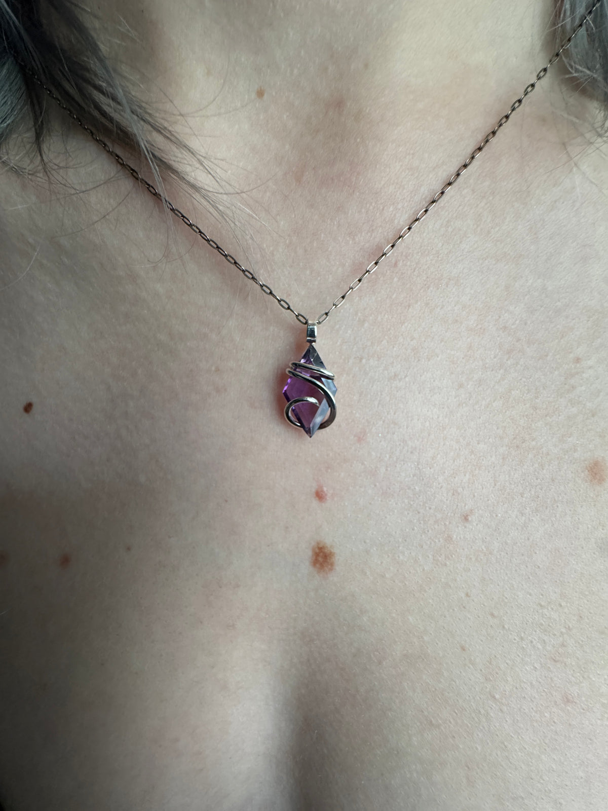 Faceted amethyst in sterling silver pendant