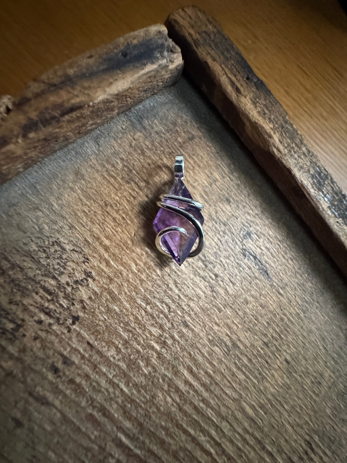 Faceted amethyst in sterling silver pendant