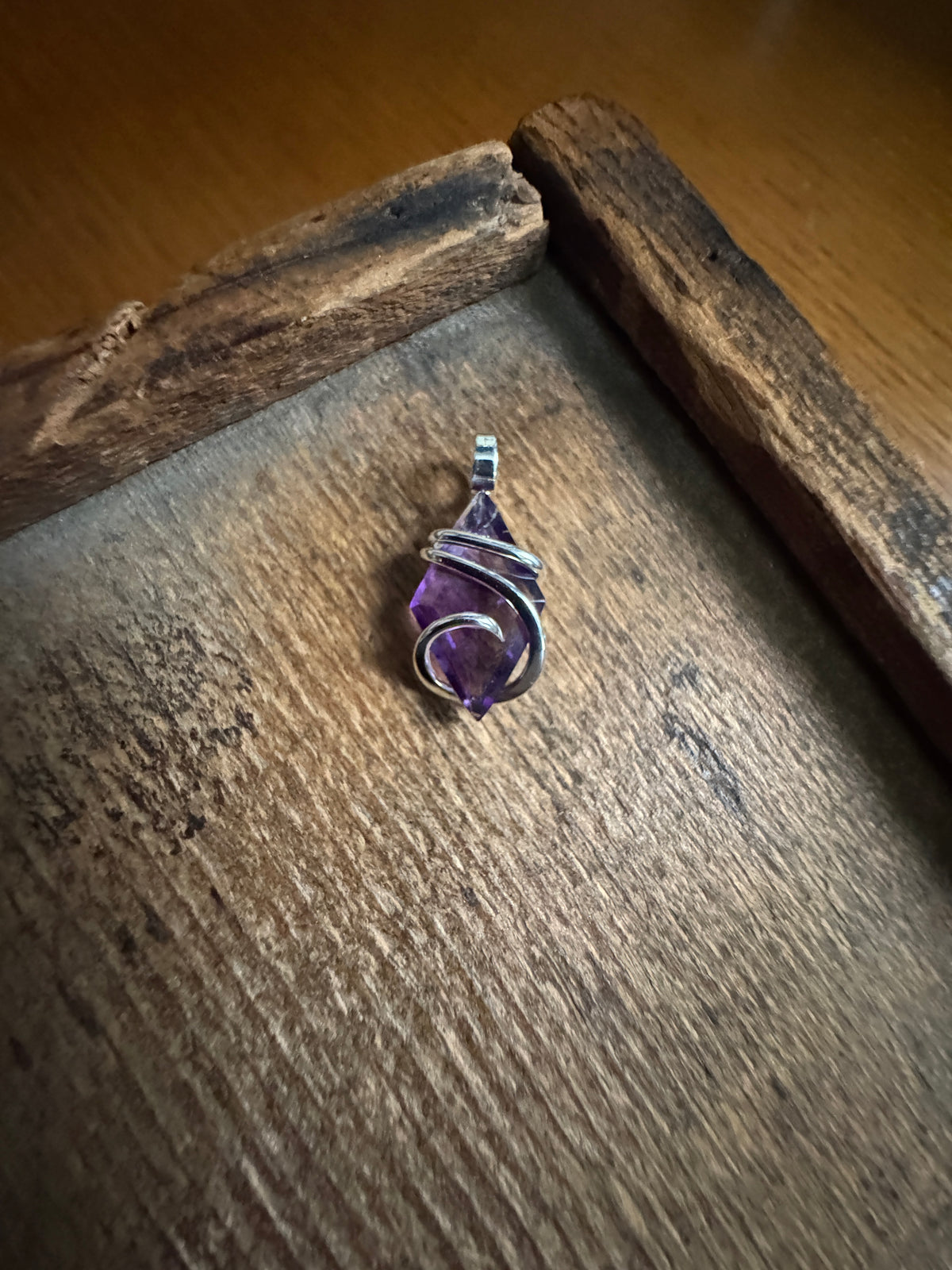 Faceted amethyst in sterling silver pendant