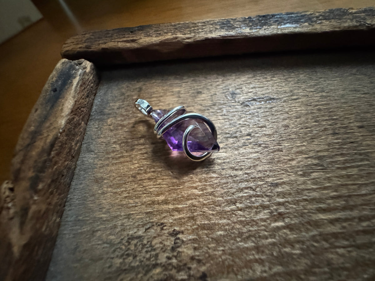 Faceted amethyst in sterling silver pendant