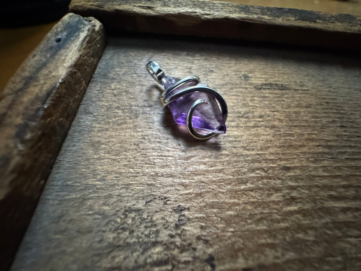 Faceted amethyst in sterling silver pendant