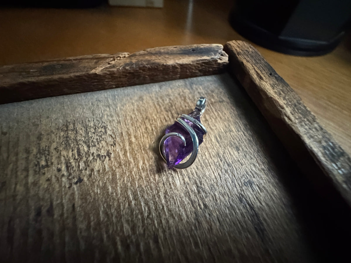 Faceted amethyst in sterling silver pendant