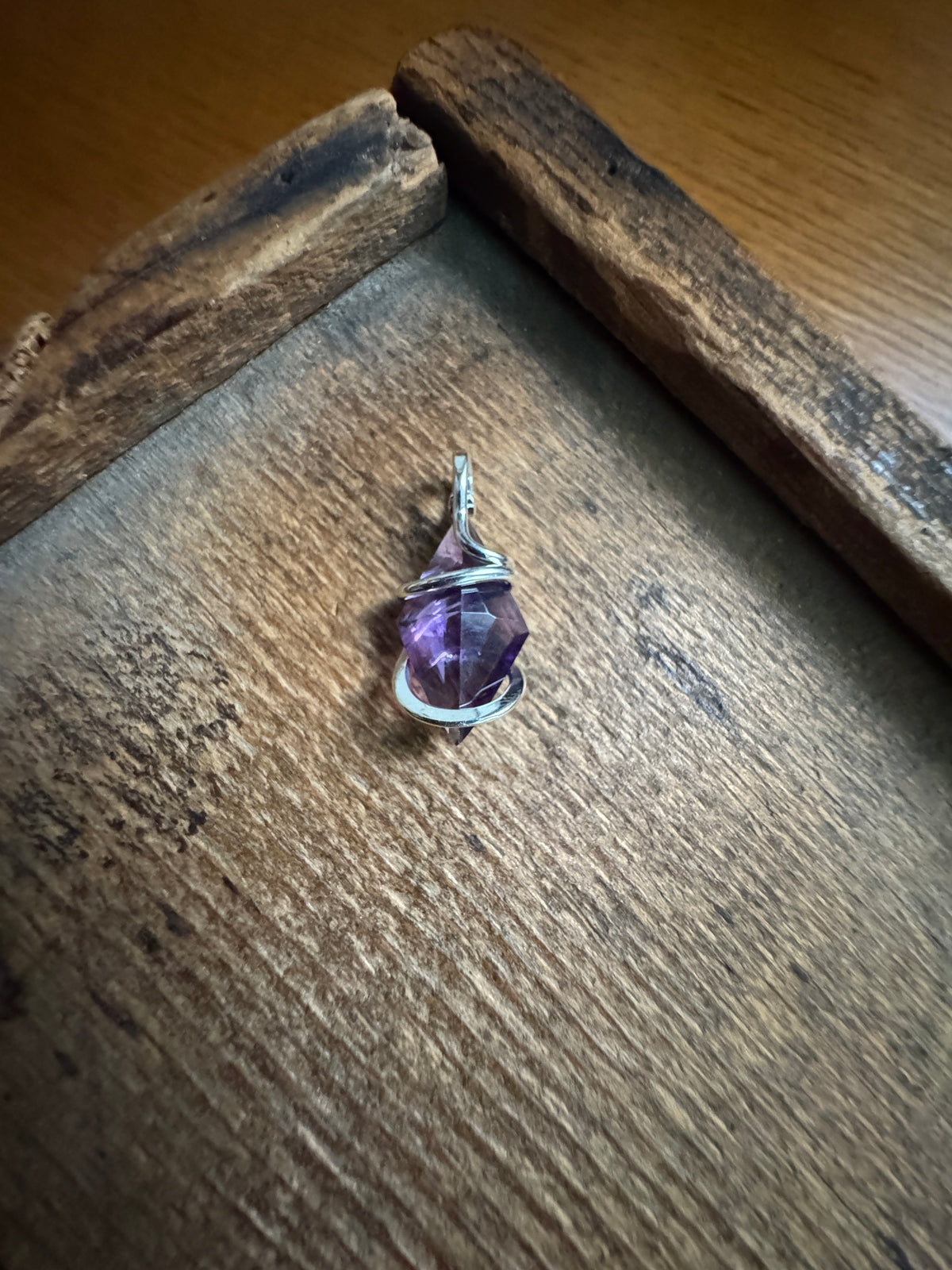 Faceted amethyst in sterling silver pendant