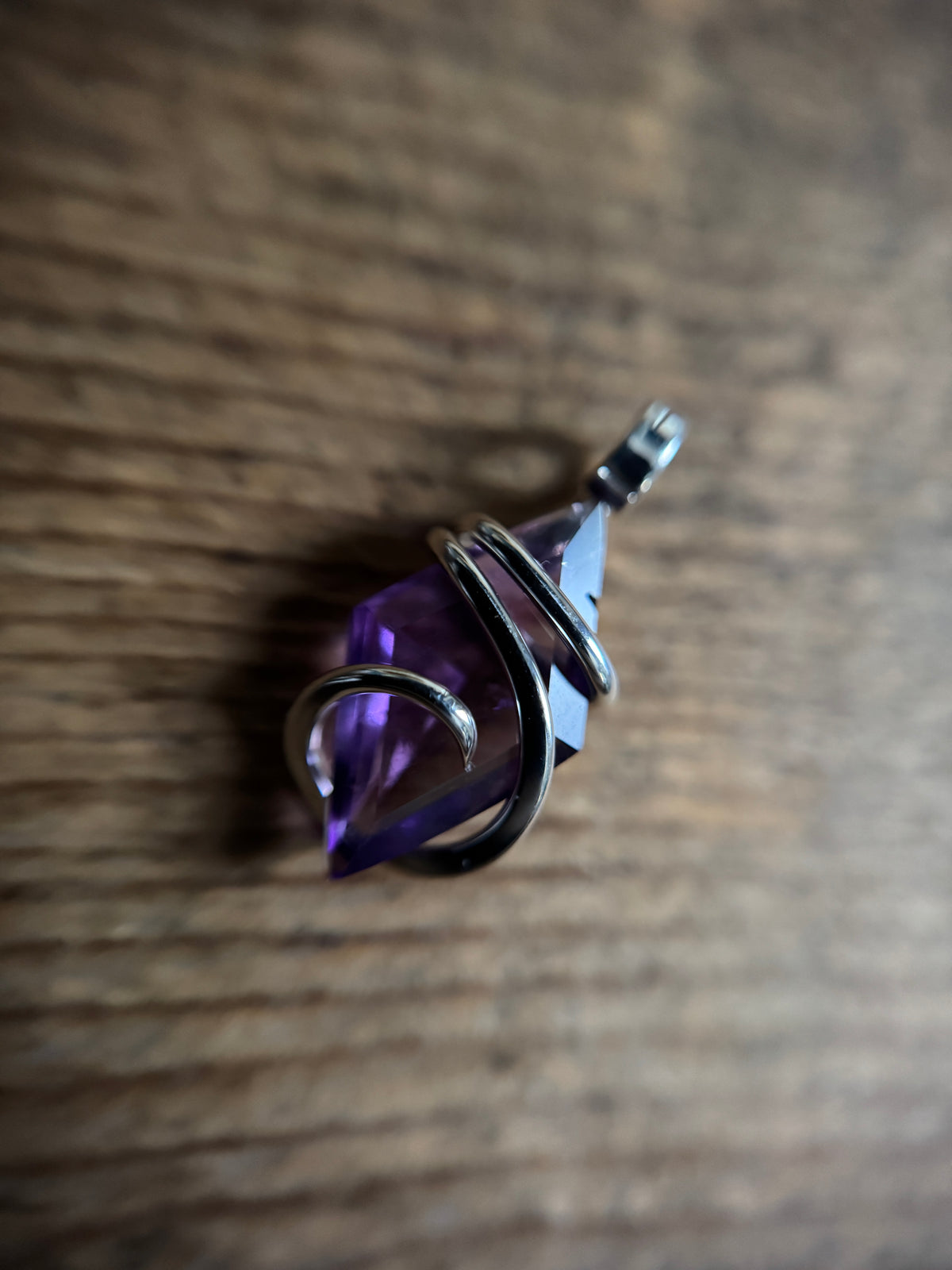Faceted amethyst in sterling silver pendant