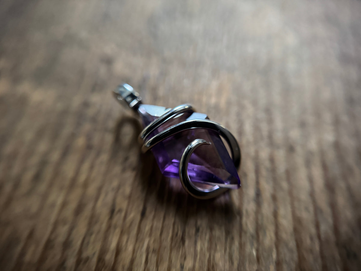 Faceted amethyst in sterling silver pendant