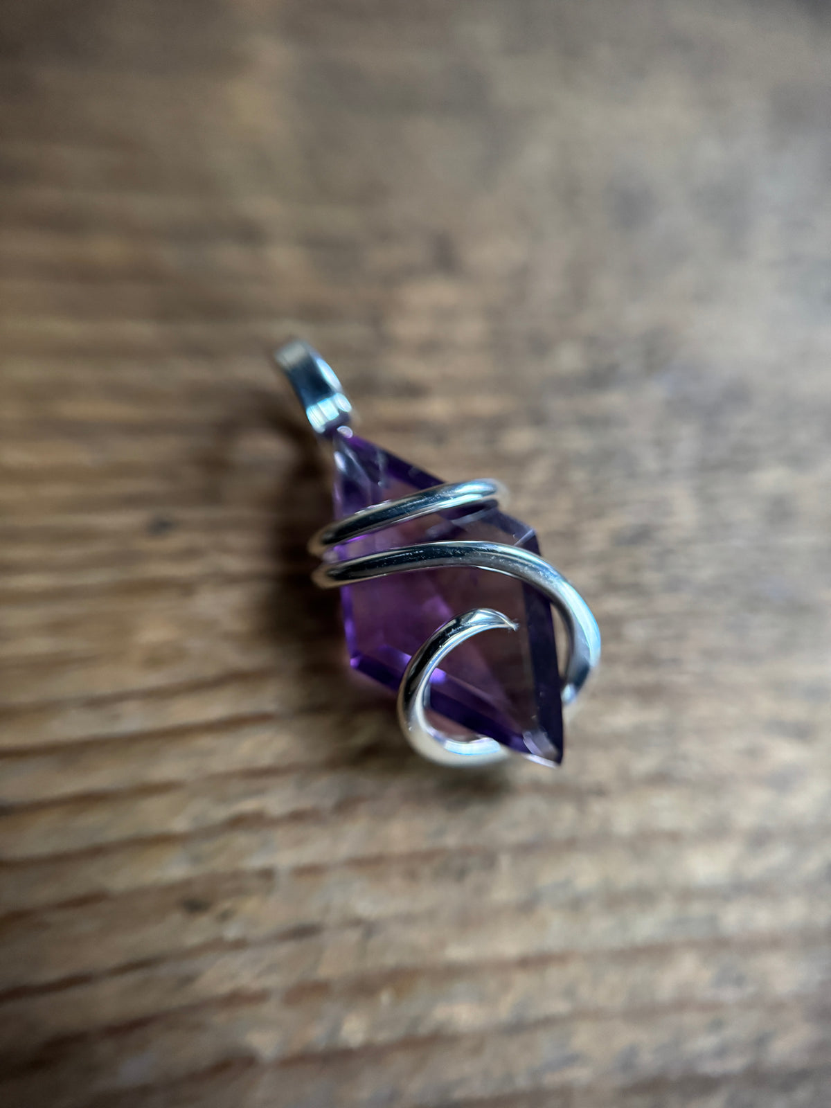 Faceted amethyst in sterling silver pendant