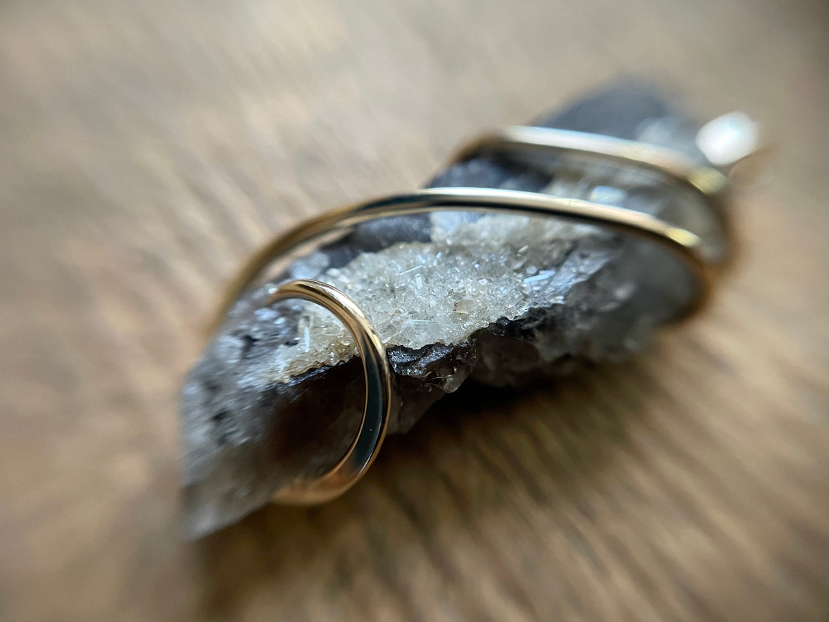 Phenakite on smokey quartz in 14k gold pendant