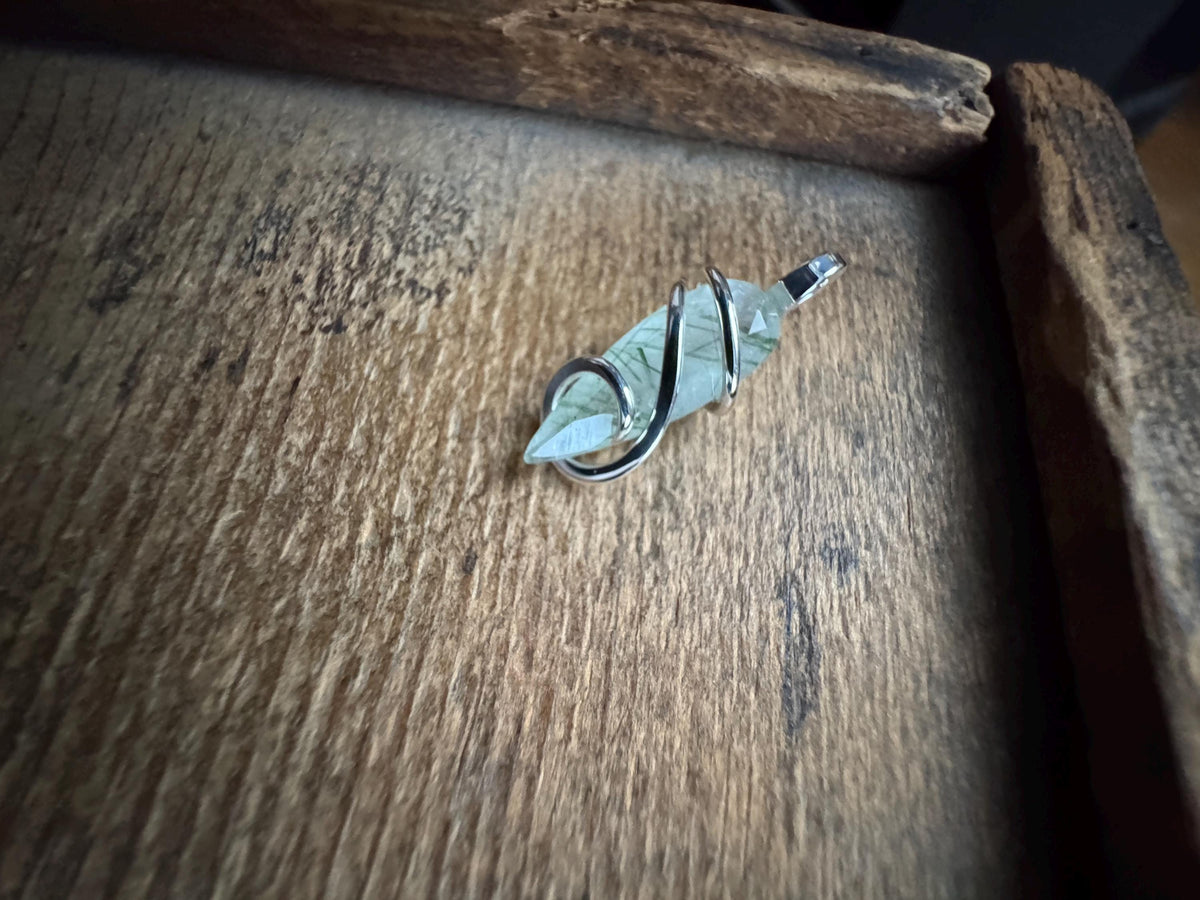 Faceted tourmalinated quartz in sterling silver pendant