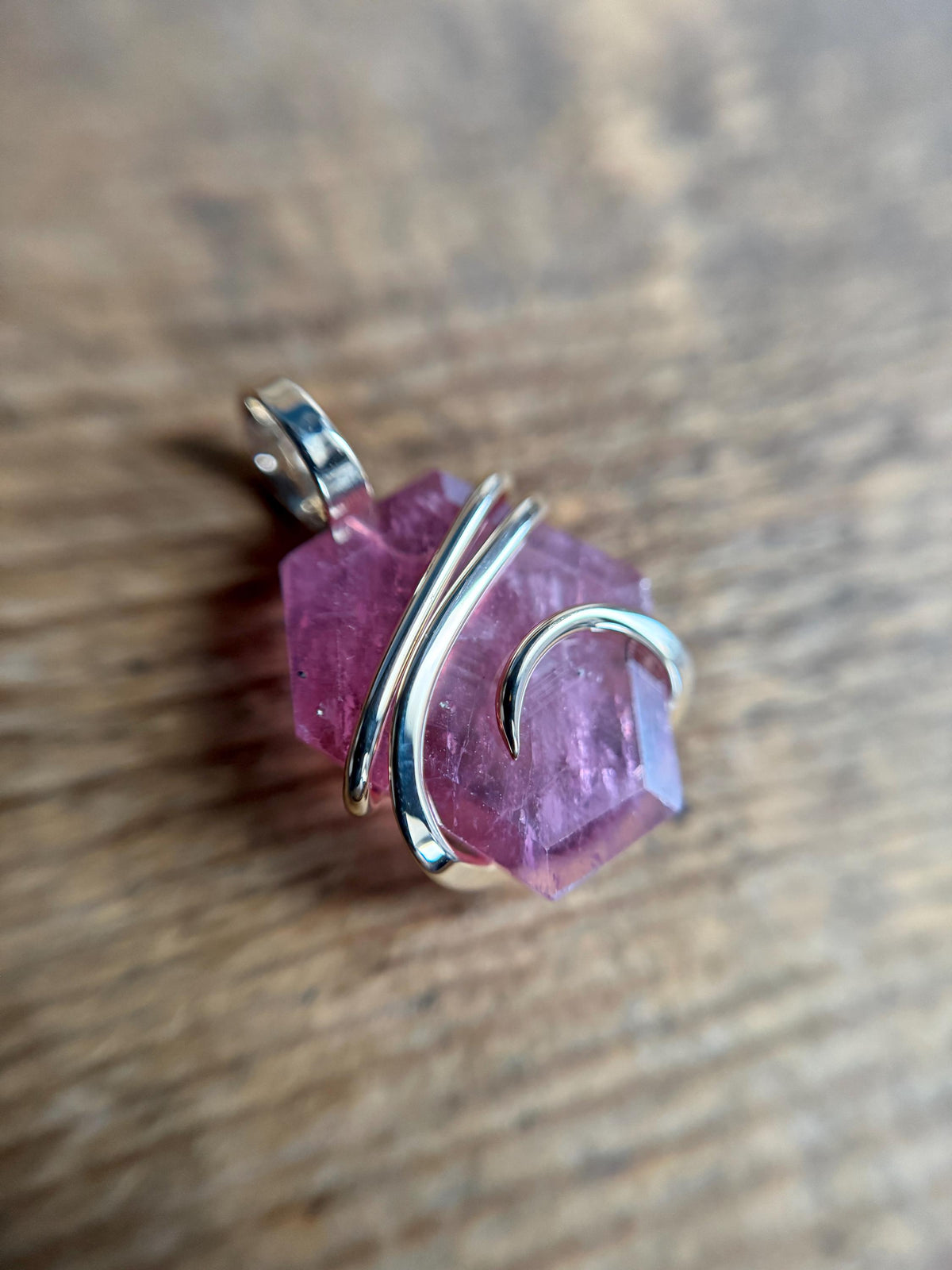 Faceted ruby set in 14kt gold pendant