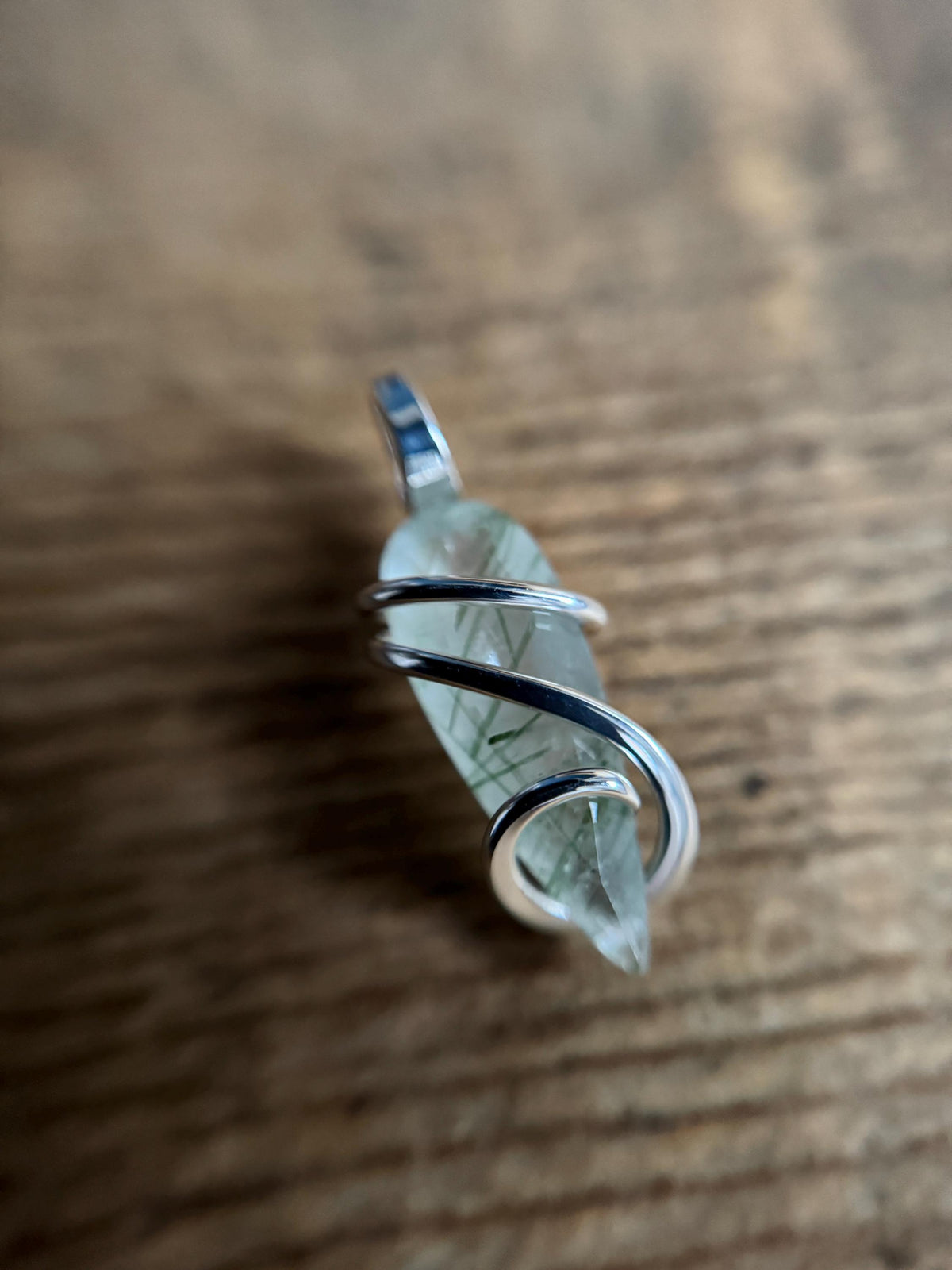 Faceted tourmalinated quartz in sterling silver pendant