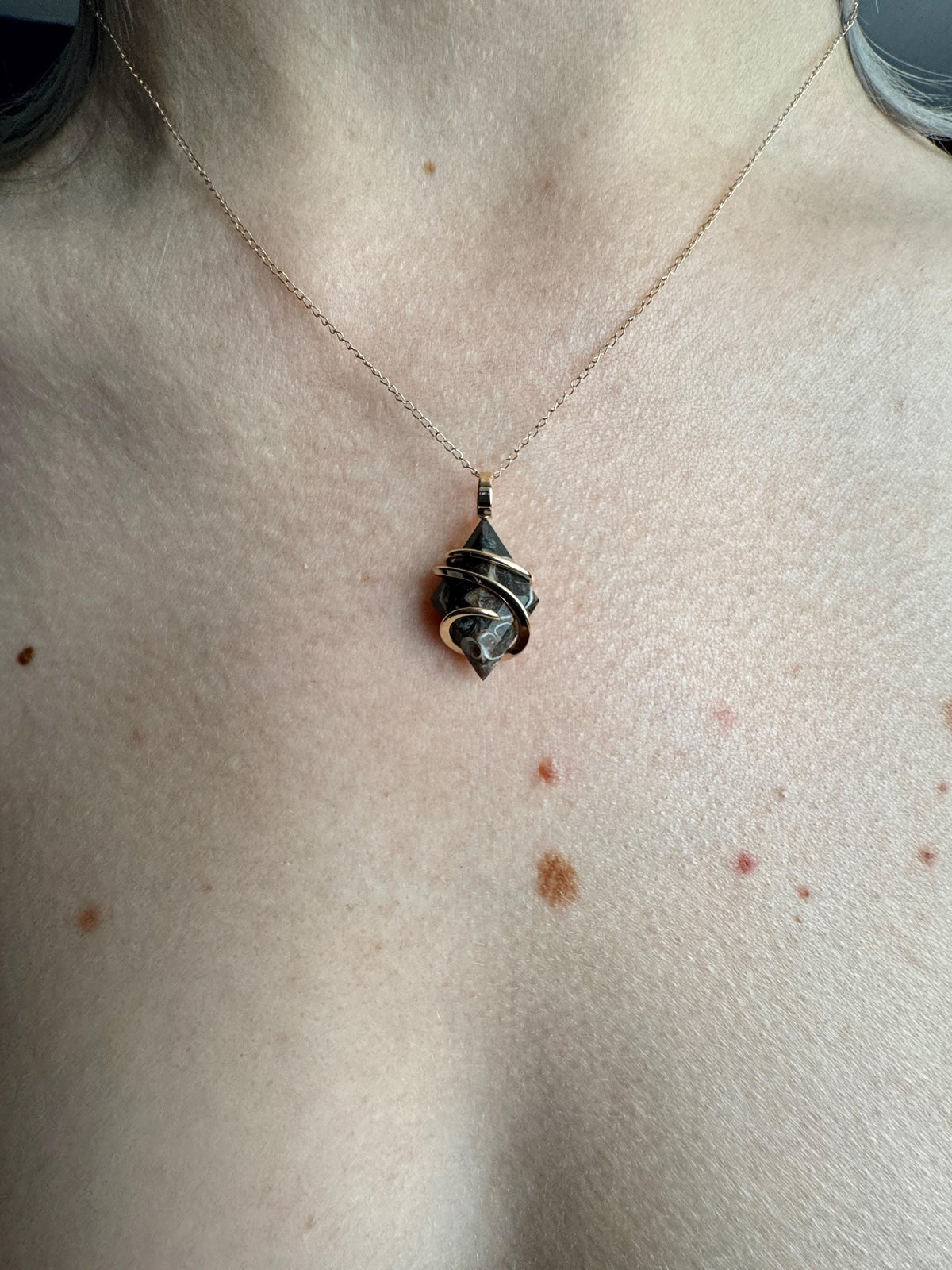 Faceted turritella agate in 14k gold pendant