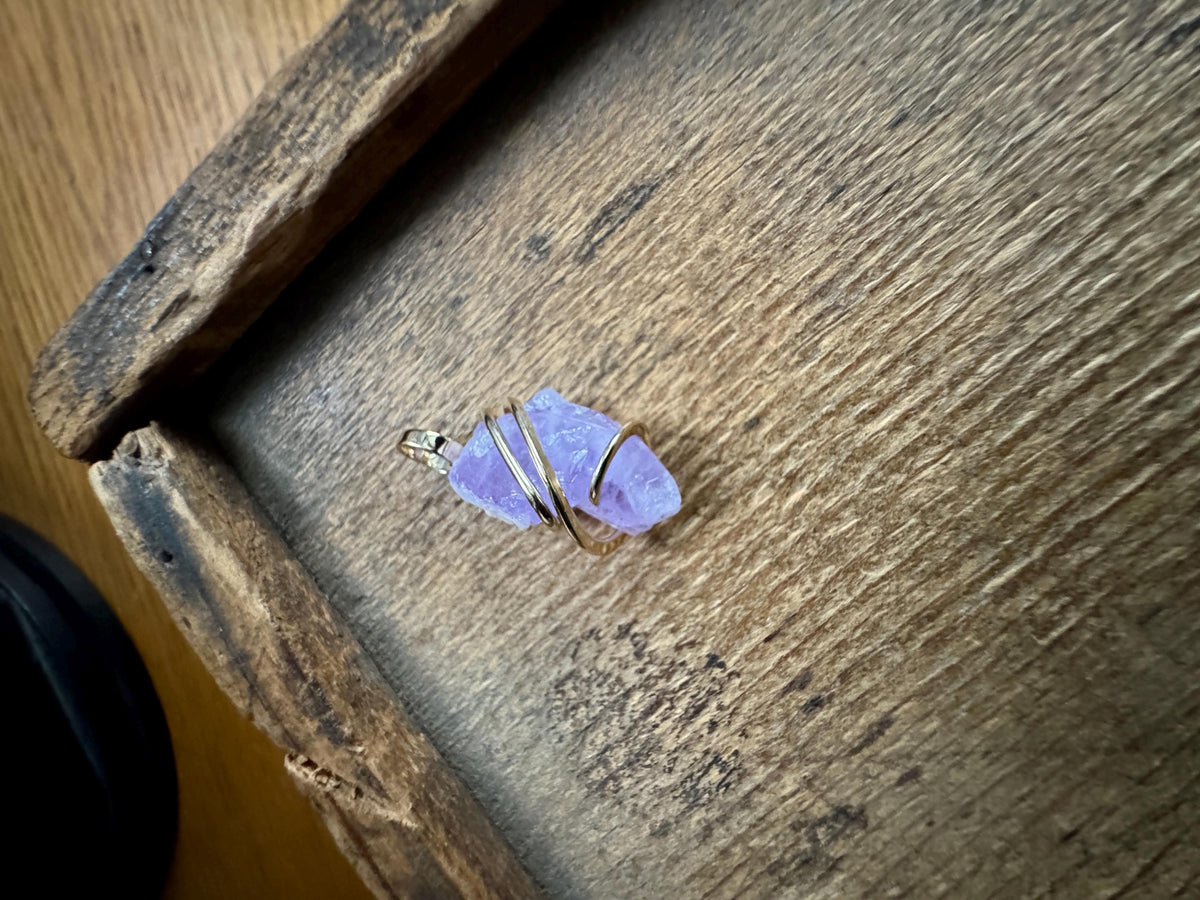 Apatite crystal in forged 14k gold pendant