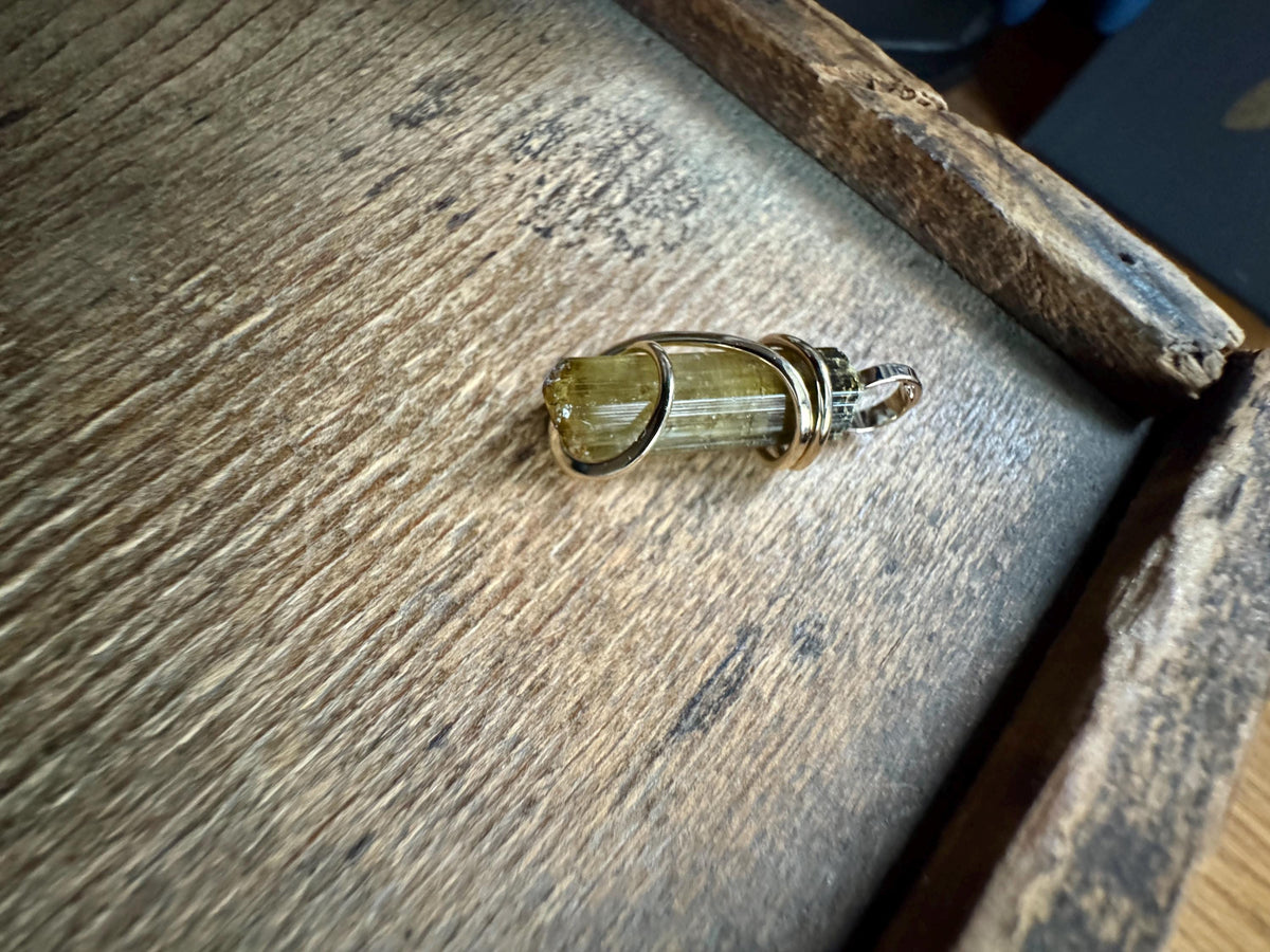 Yellow tourmaline crystal in 14k gold pendant