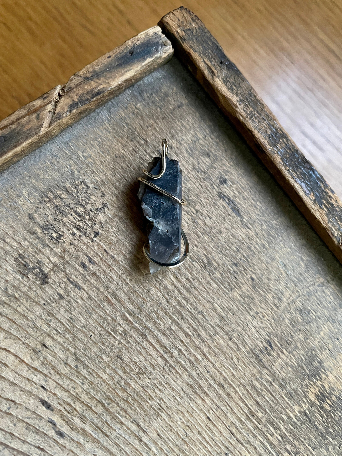 Phenakite on smokey quartz in 14k gold pendant