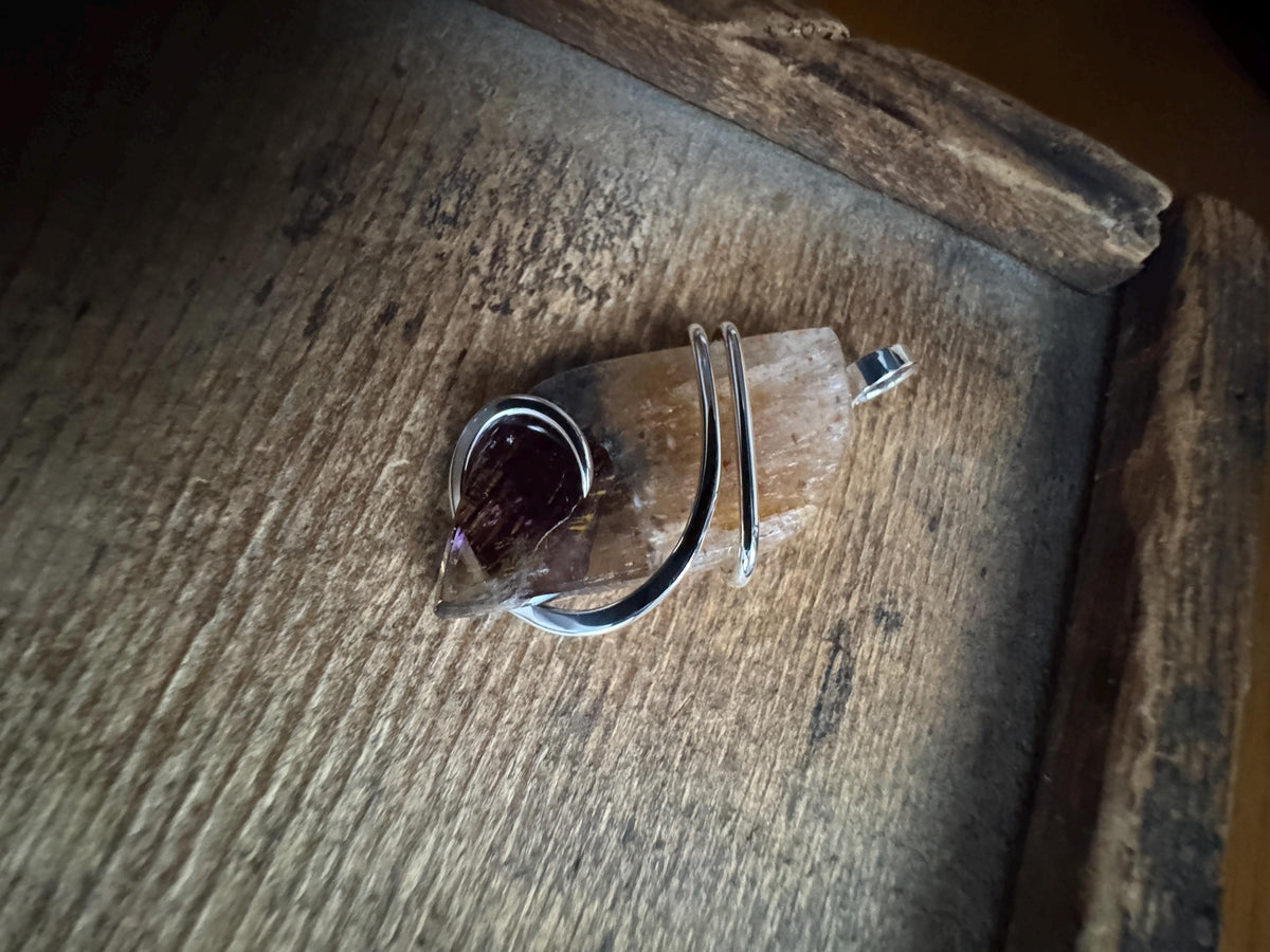 Faceted super seven in sterling silver pendant