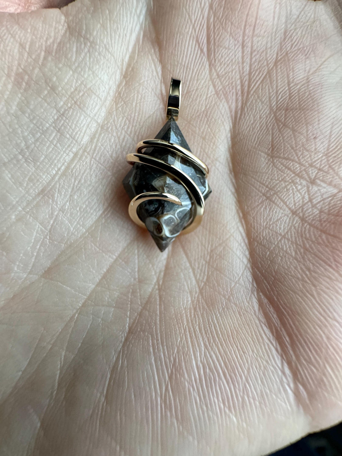 Faceted turritella agate in 14k gold pendant