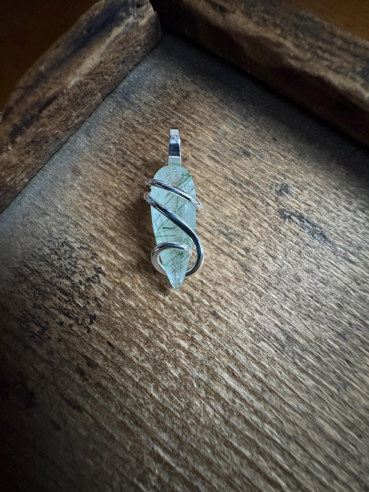Faceted tourmalinated quartz in sterling silver pendant