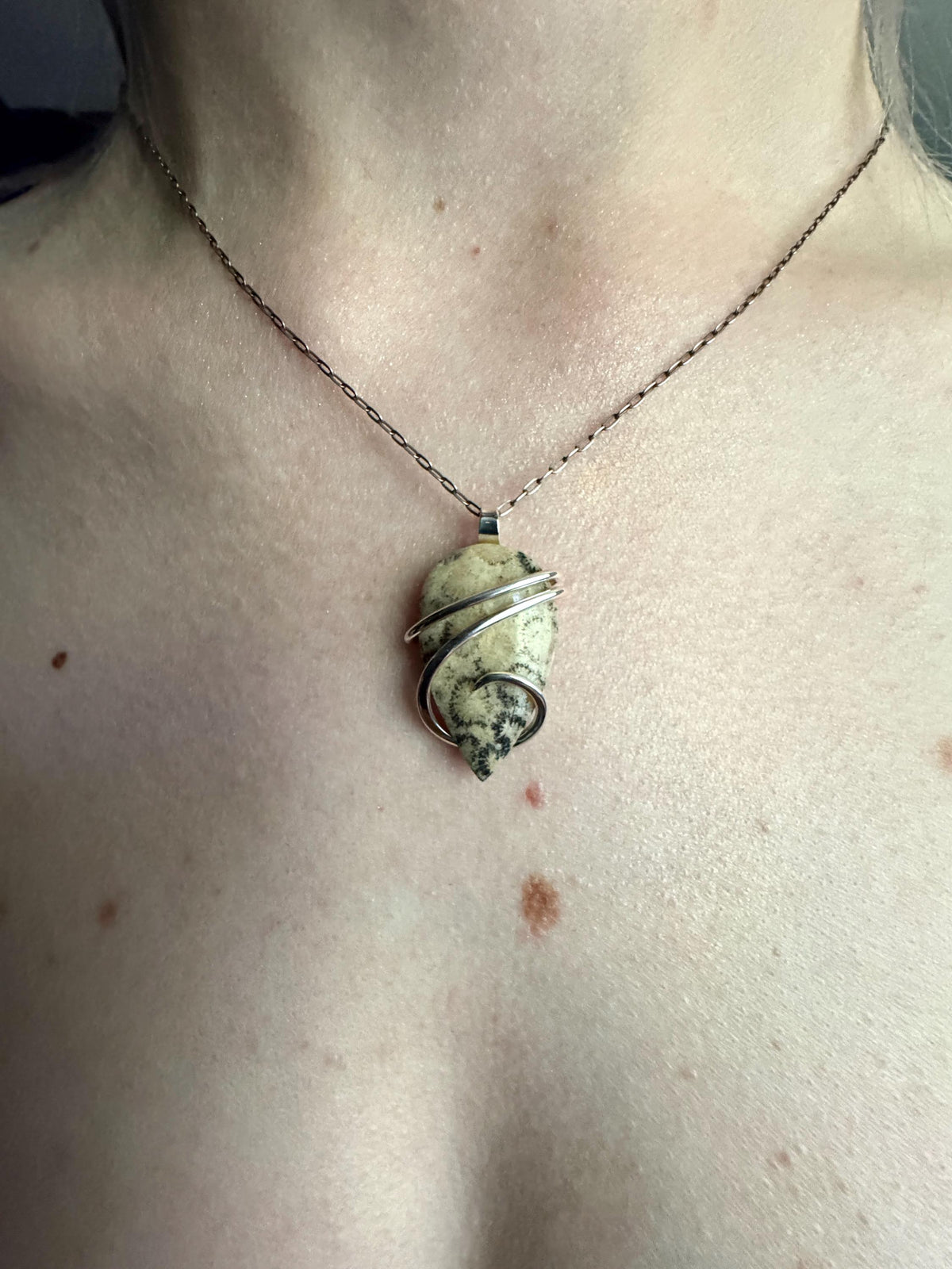 Fossilized coral in sterling silver pendant