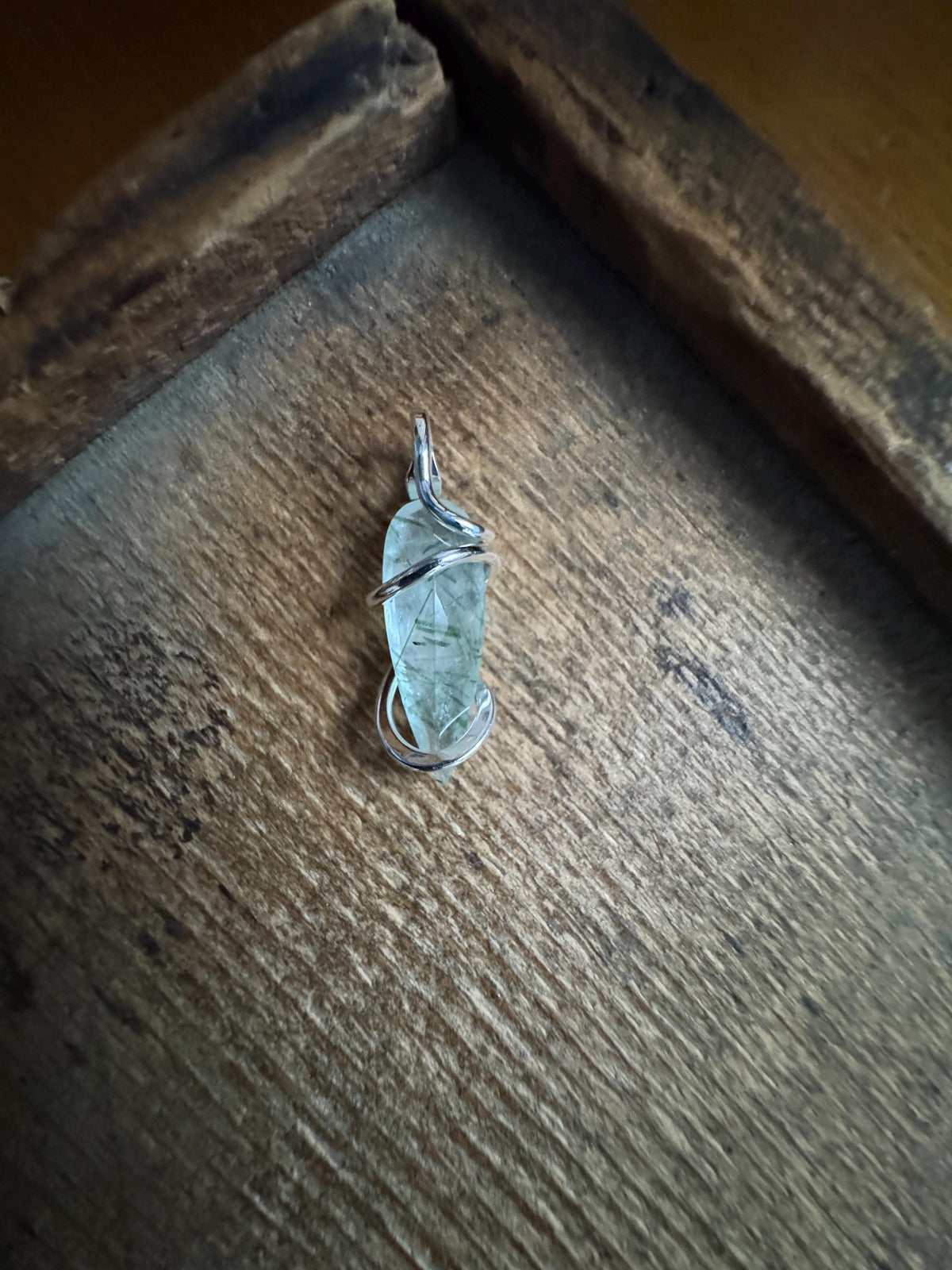 Faceted tourmalinated quartz in sterling silver pendant