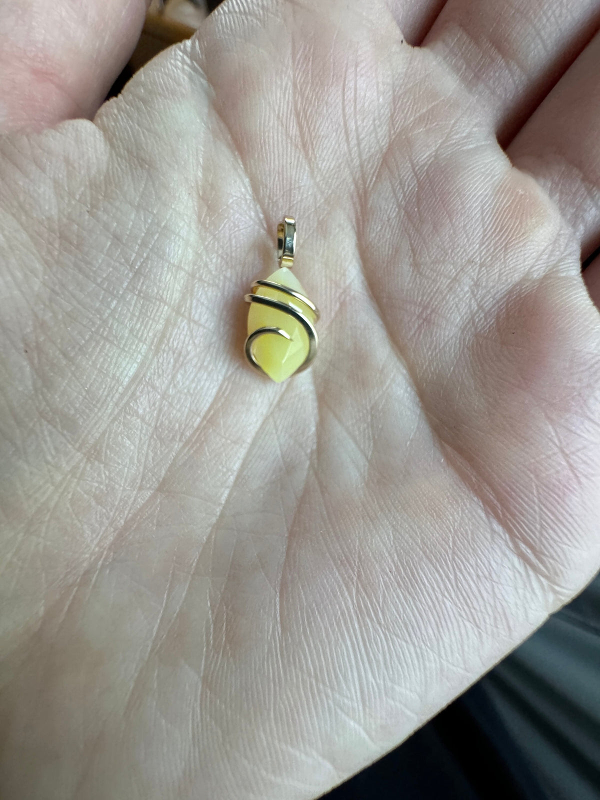Faceted smithsonite in 14k gold pendant