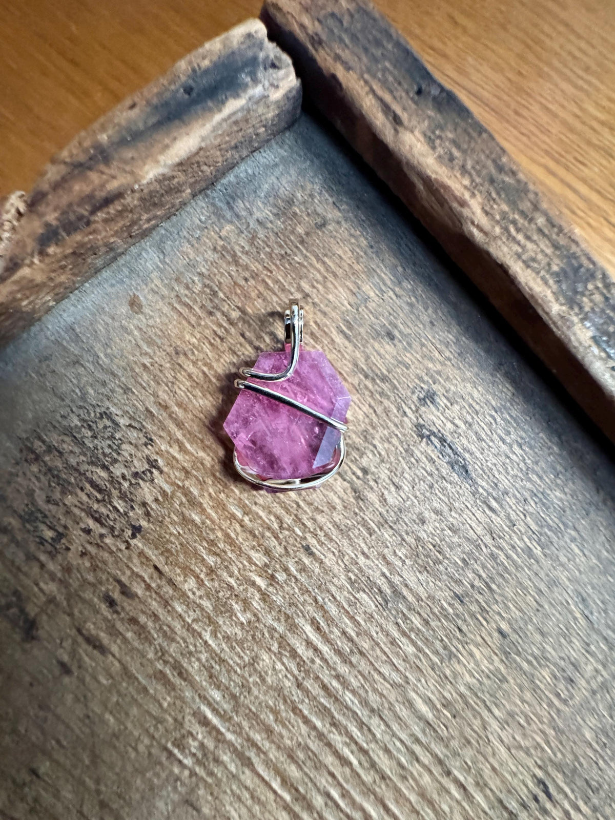 Faceted ruby set in 14kt gold pendant