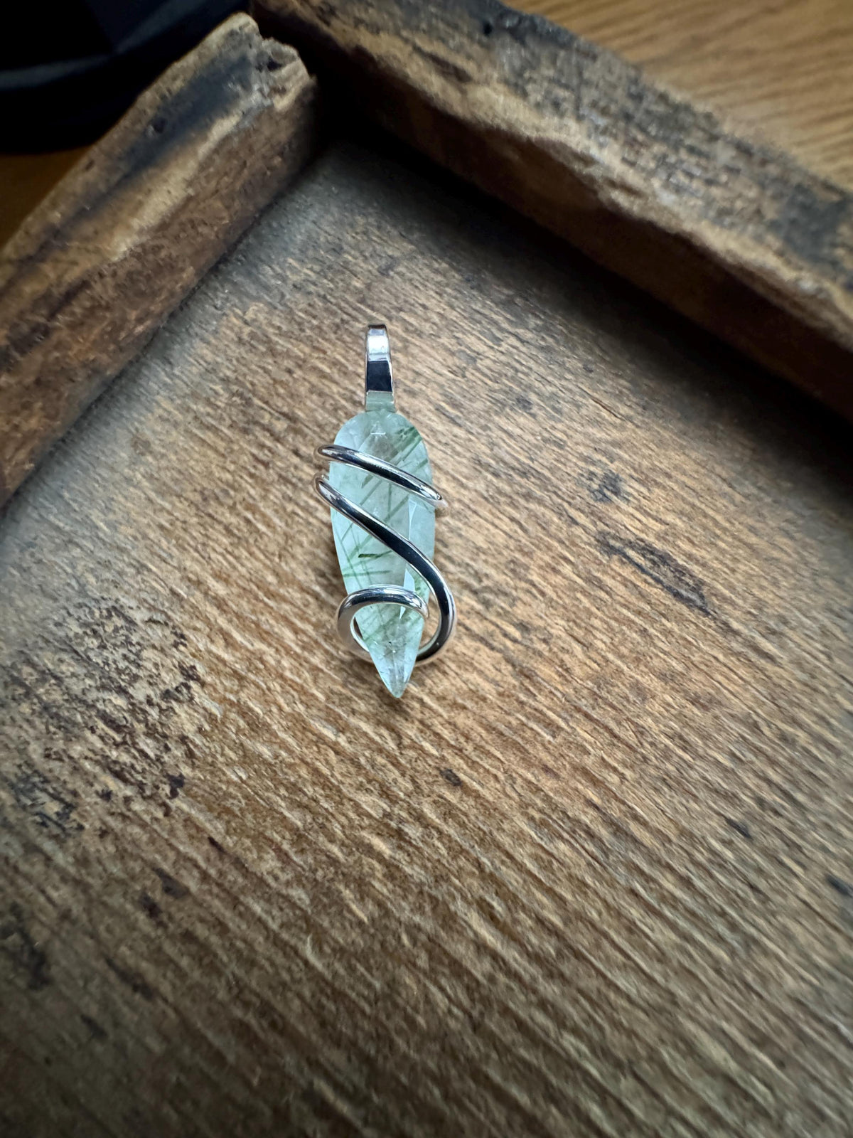 Faceted tourmalinated quartz in sterling silver pendant