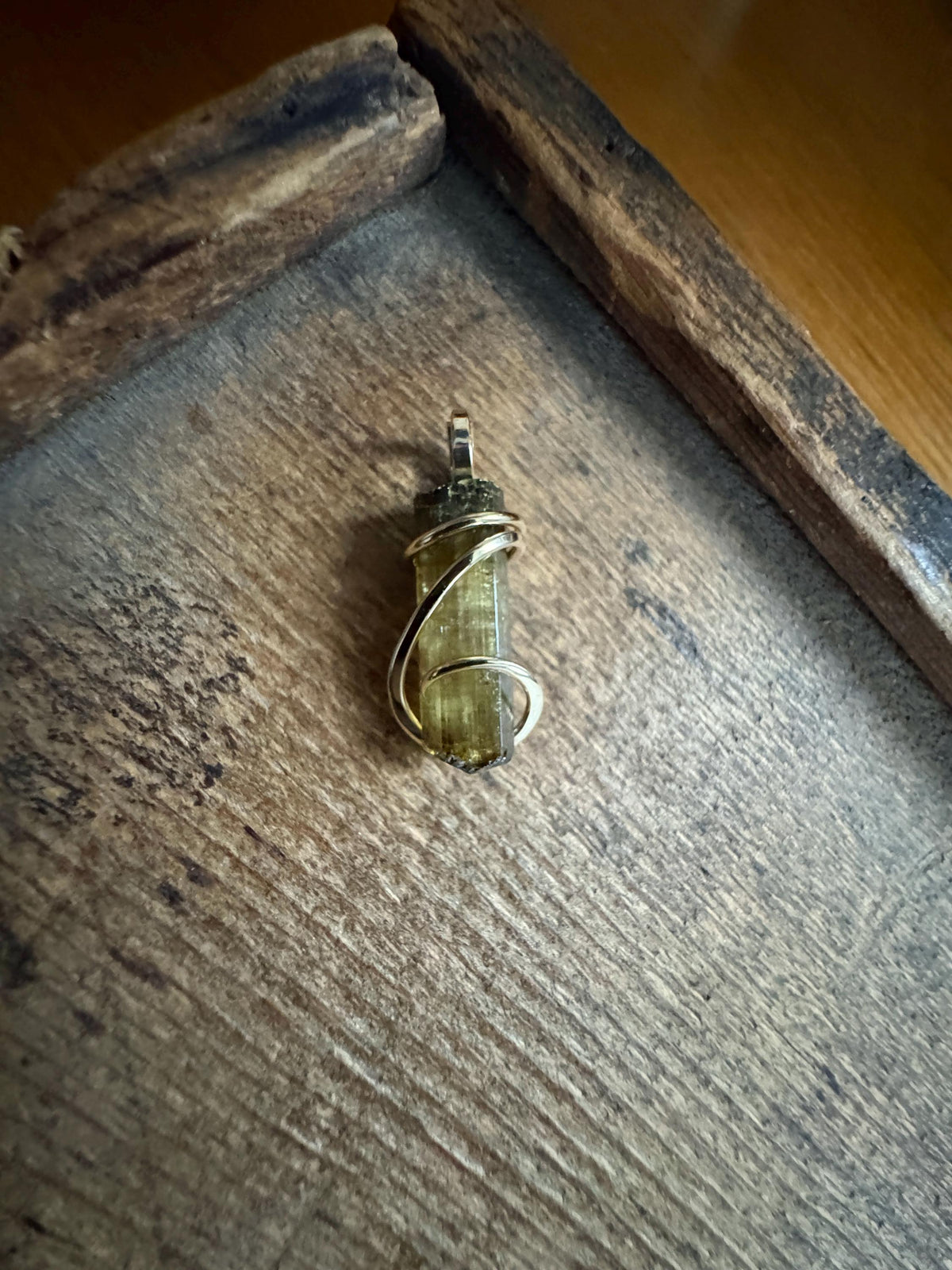 Yellow tourmaline crystal in 14k gold pendant