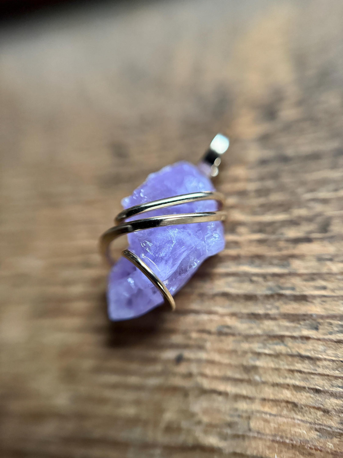 Apatite crystal in forged 14k gold pendant