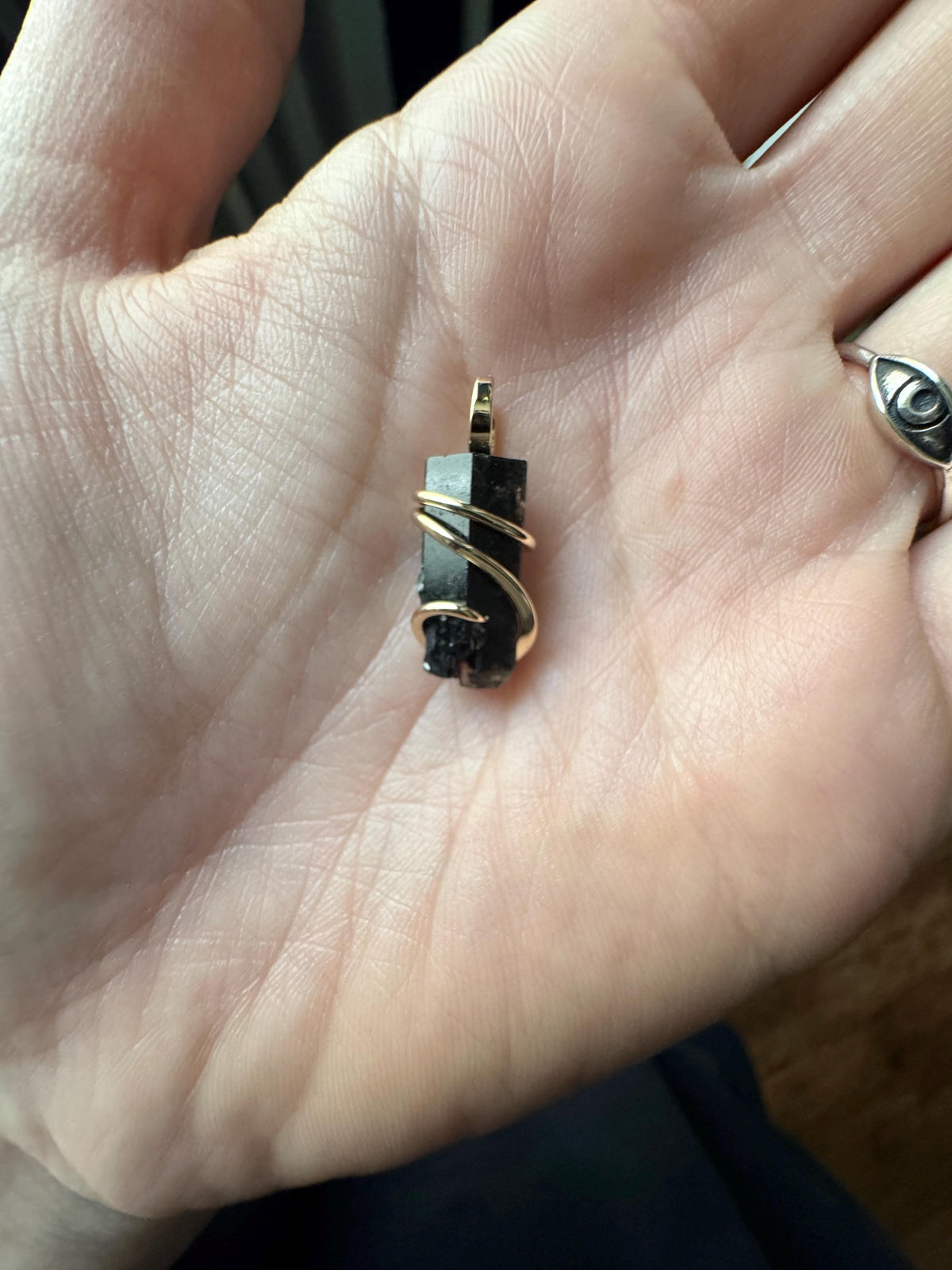 Black topaz crystal in 14k gold pendant