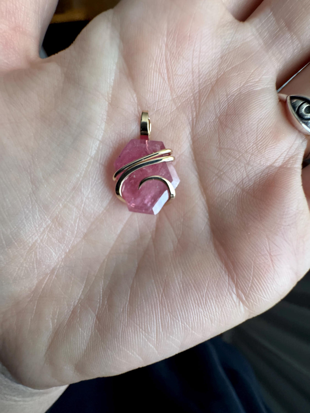 Faceted ruby set in 14kt gold pendant