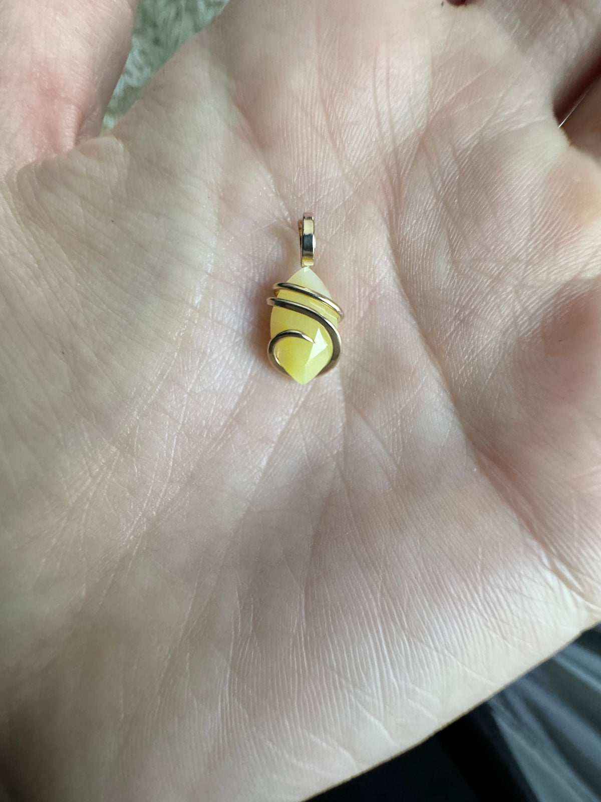Faceted smithsonite in 14k gold pendant