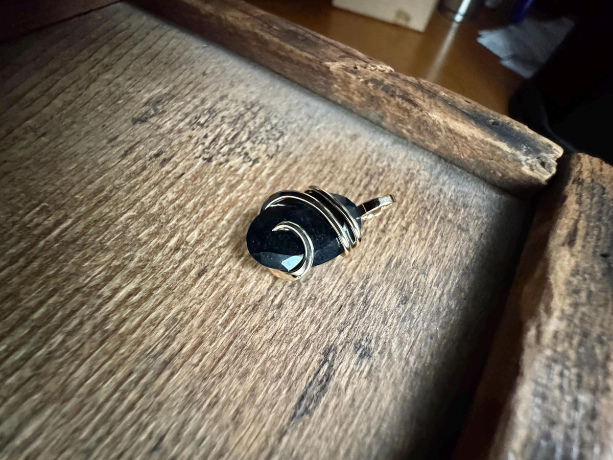 Faceted black tourmaline in 14k gold pendant
