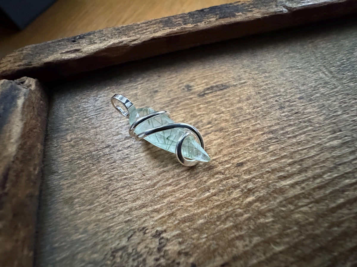 Faceted tourmalinated quartz in sterling silver pendant