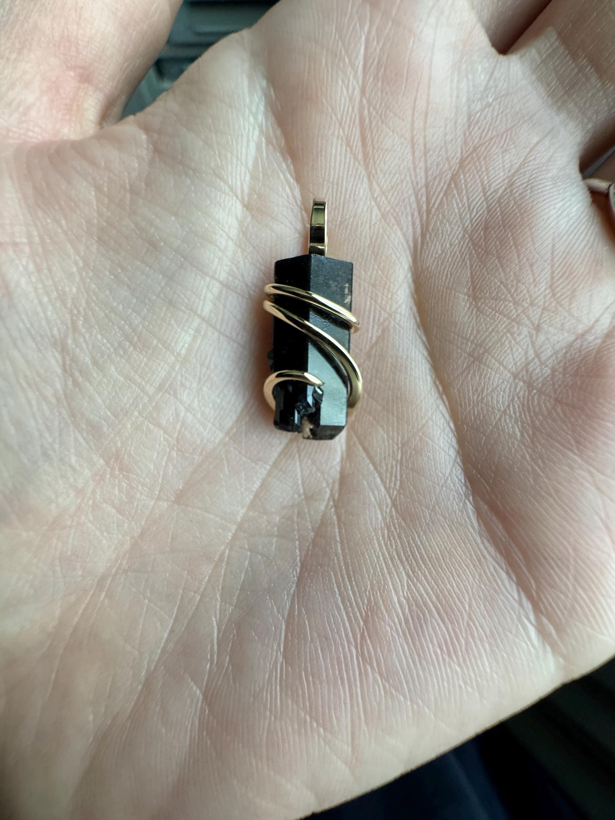 Black topaz crystal in 14k gold pendant