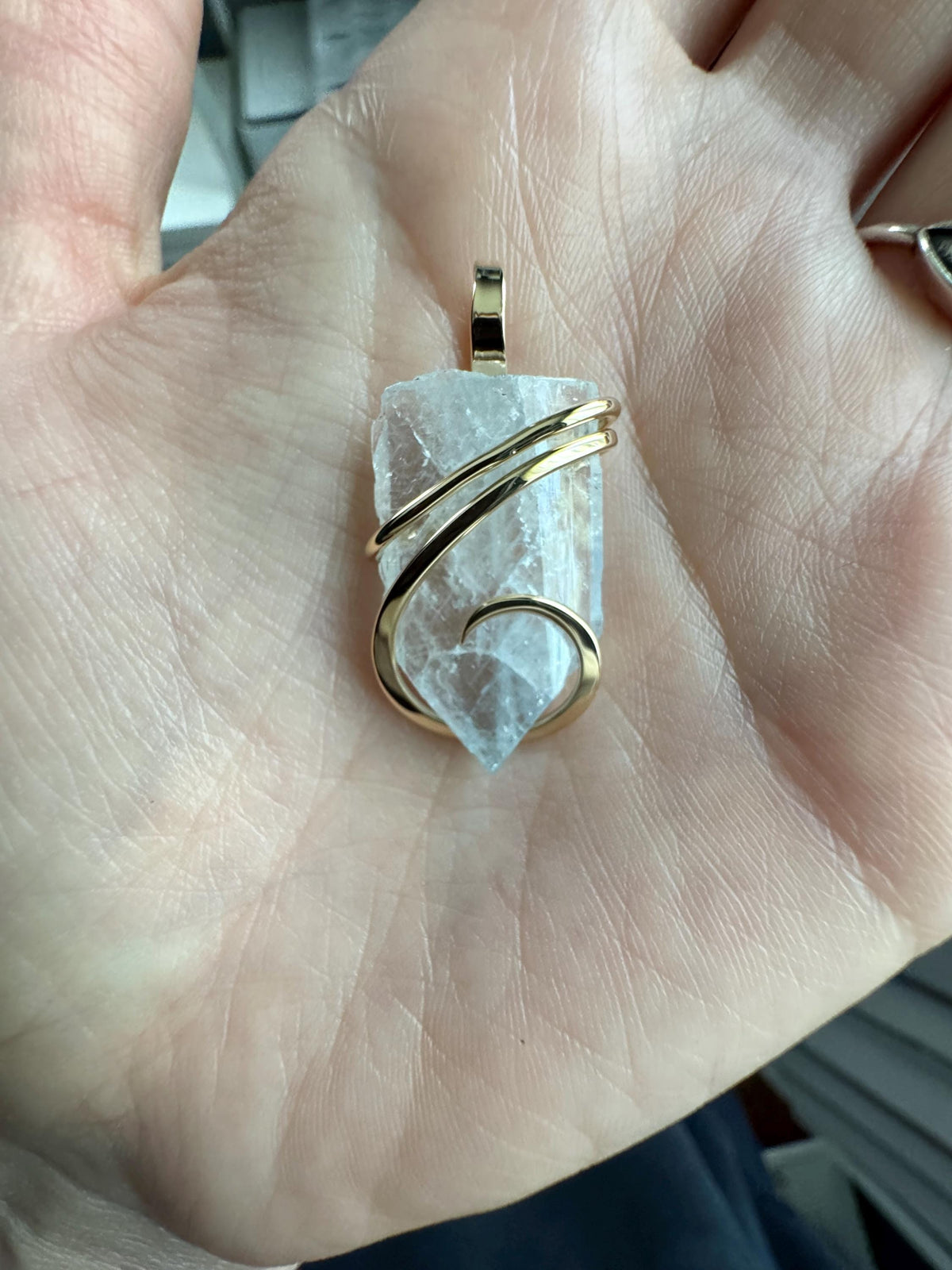 Blue celestite crystal in 14k gold pendant