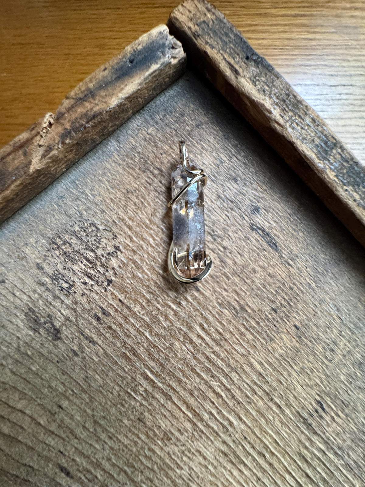 Topaz crystal in 14k gold pendant