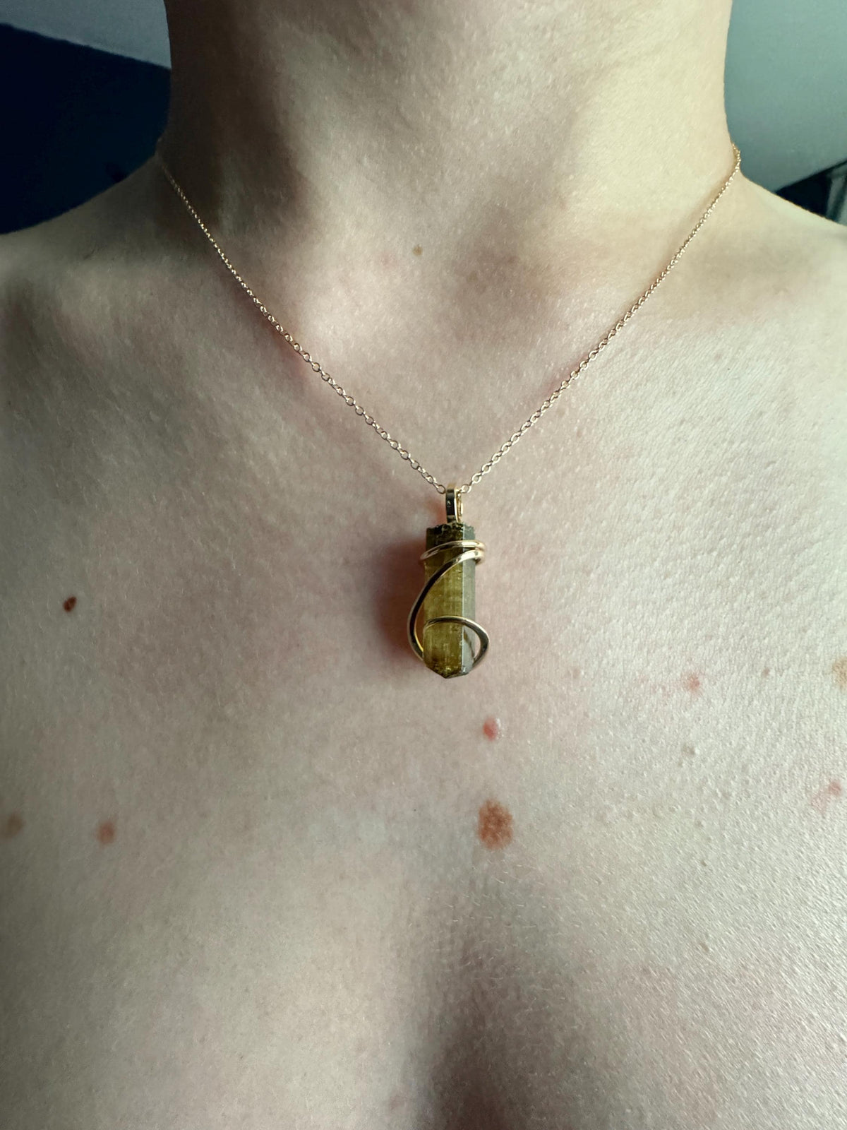 Yellow tourmaline crystal in 14k gold pendant