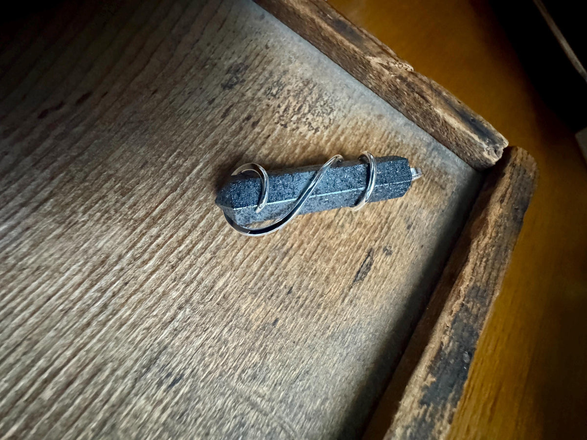 Hematite point in sterling silver pendant